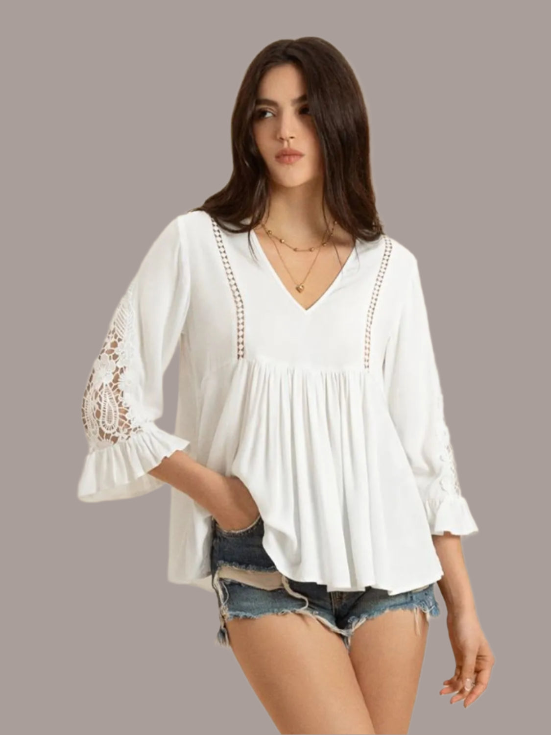 Women's white V-neck lace flounce sleeve top front view
