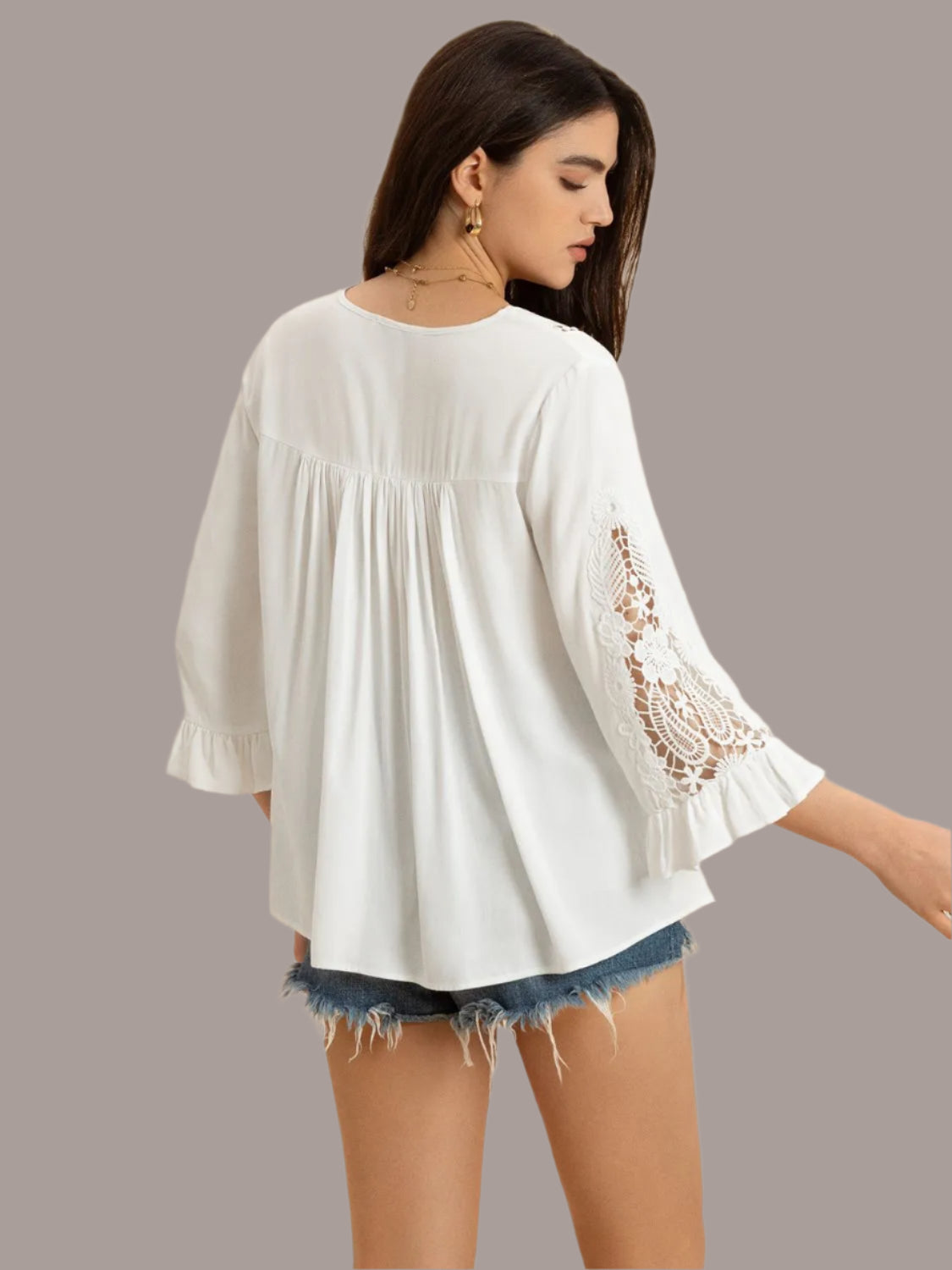 Women's white V-neck lace flounce sleeve top front view