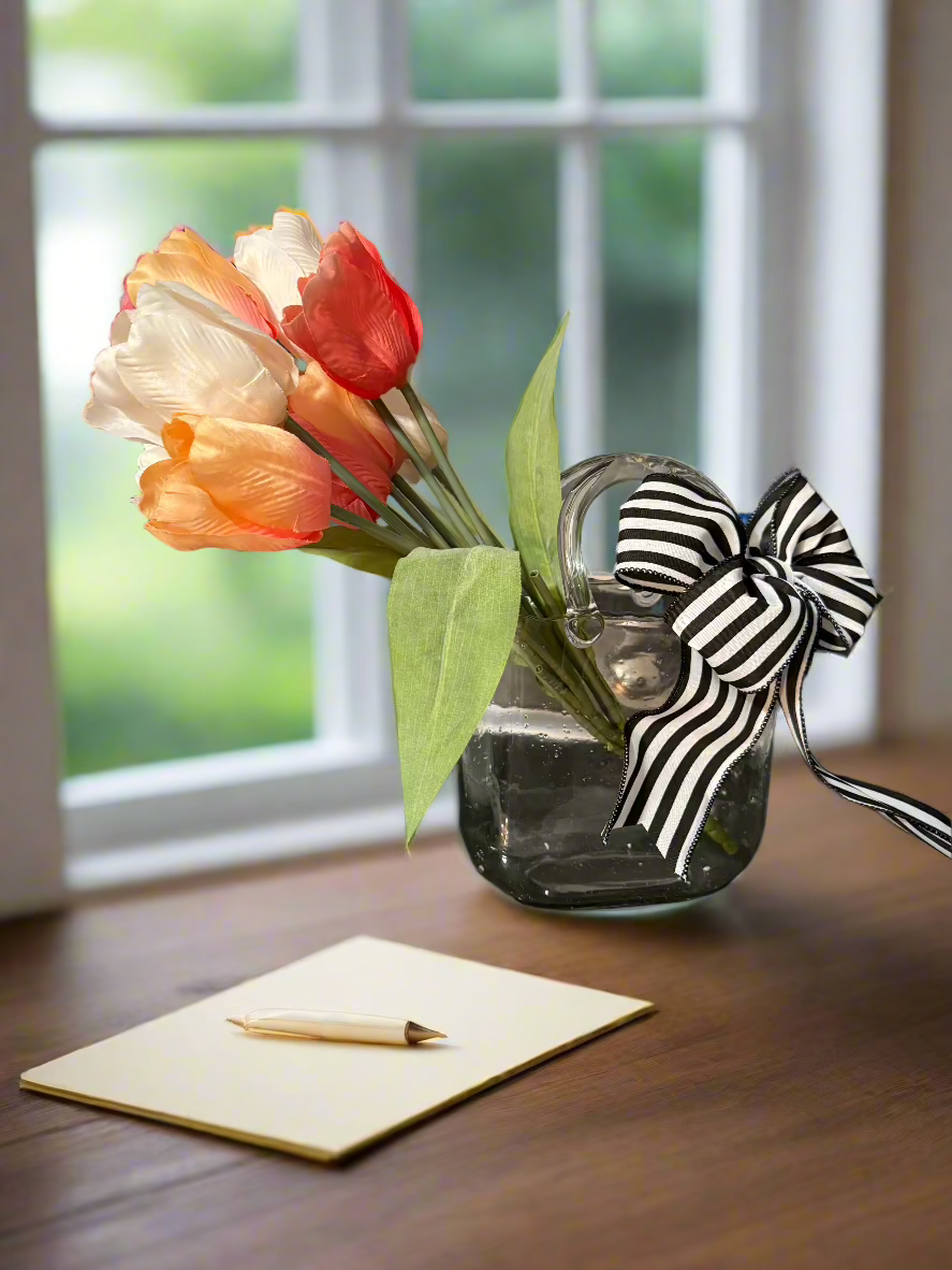 Handcrafted clear glass handbag vase with peach and coral tulips, black and white striped designer bow, perfect for Mother's Day gifts