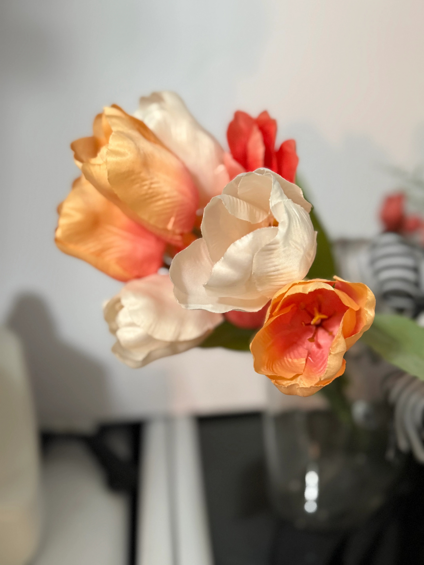 The Secret Garden decorative book vases collection with elegant gold frame detailing and black floral design, paired with artificial coral roses and yellow accent flowers