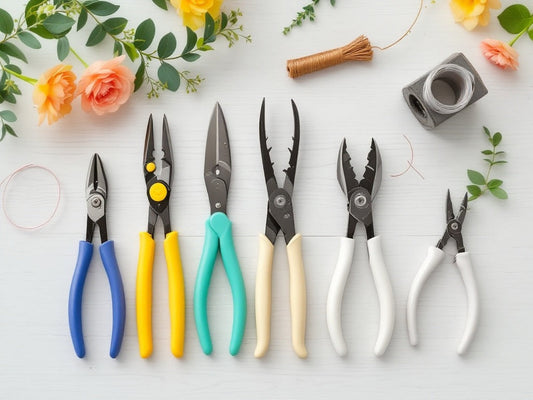 Professional floral wire cutters displayed with wreath making supplies including floral wire, ribbons, and greenery on wooden surface - Paisley Decor It essential tools guide