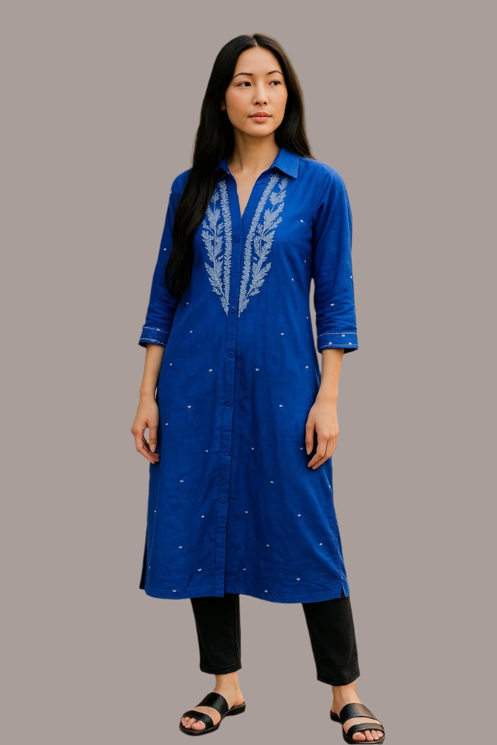 Women wearing blue handmade cotton tunic with floral embroidery,