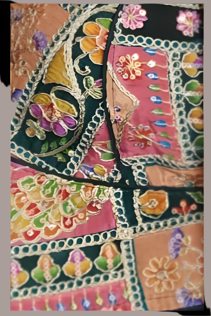 Green Kalamkari inspired and embroidered fabric with floral patterns on a black background