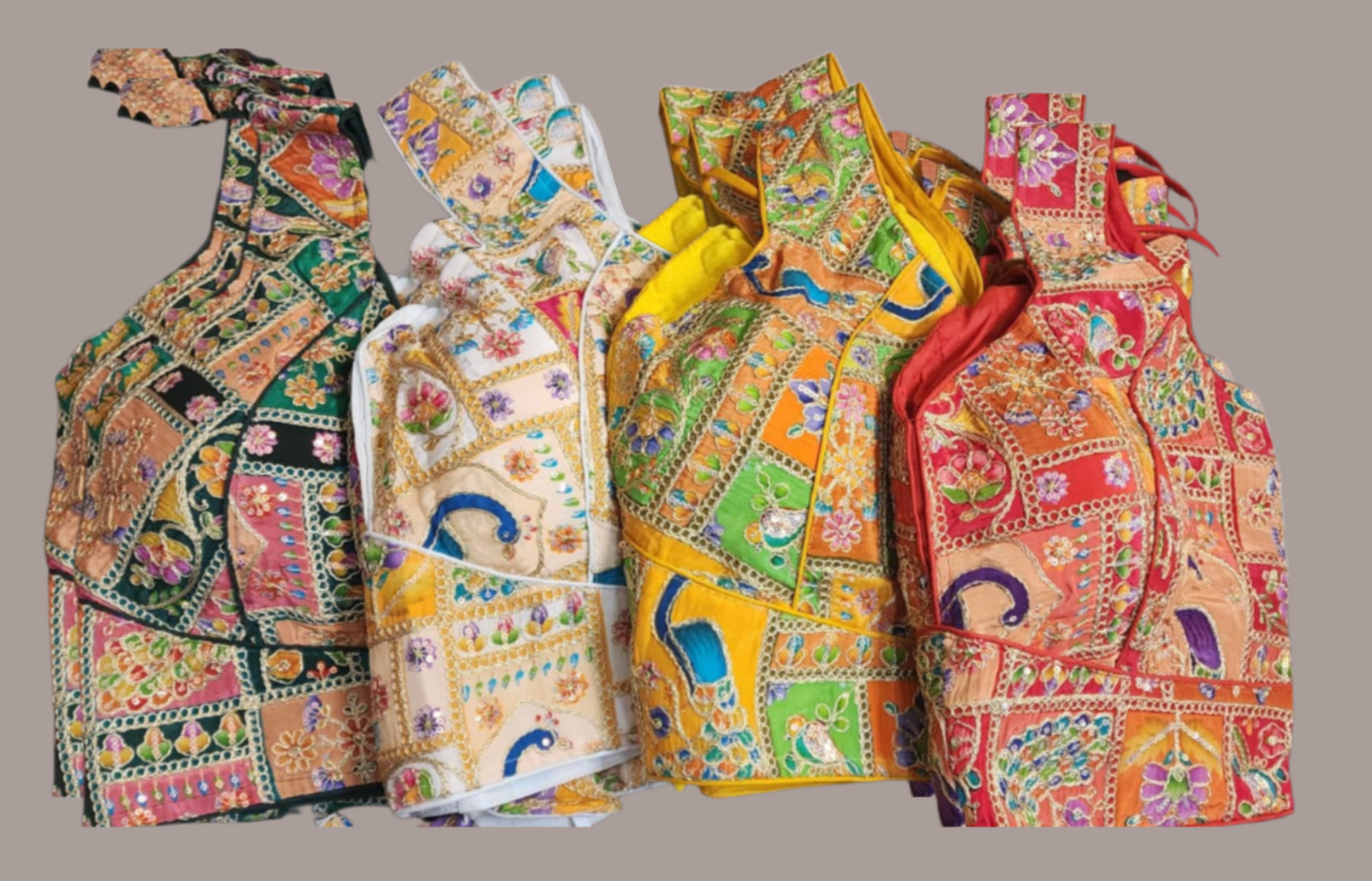 Four colorful patterned Sari Blouse arranged in a row on a white background