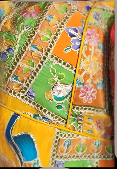 Yellow Kalamkari Inspired and gold embroidered fabric with floral and bird patterns.