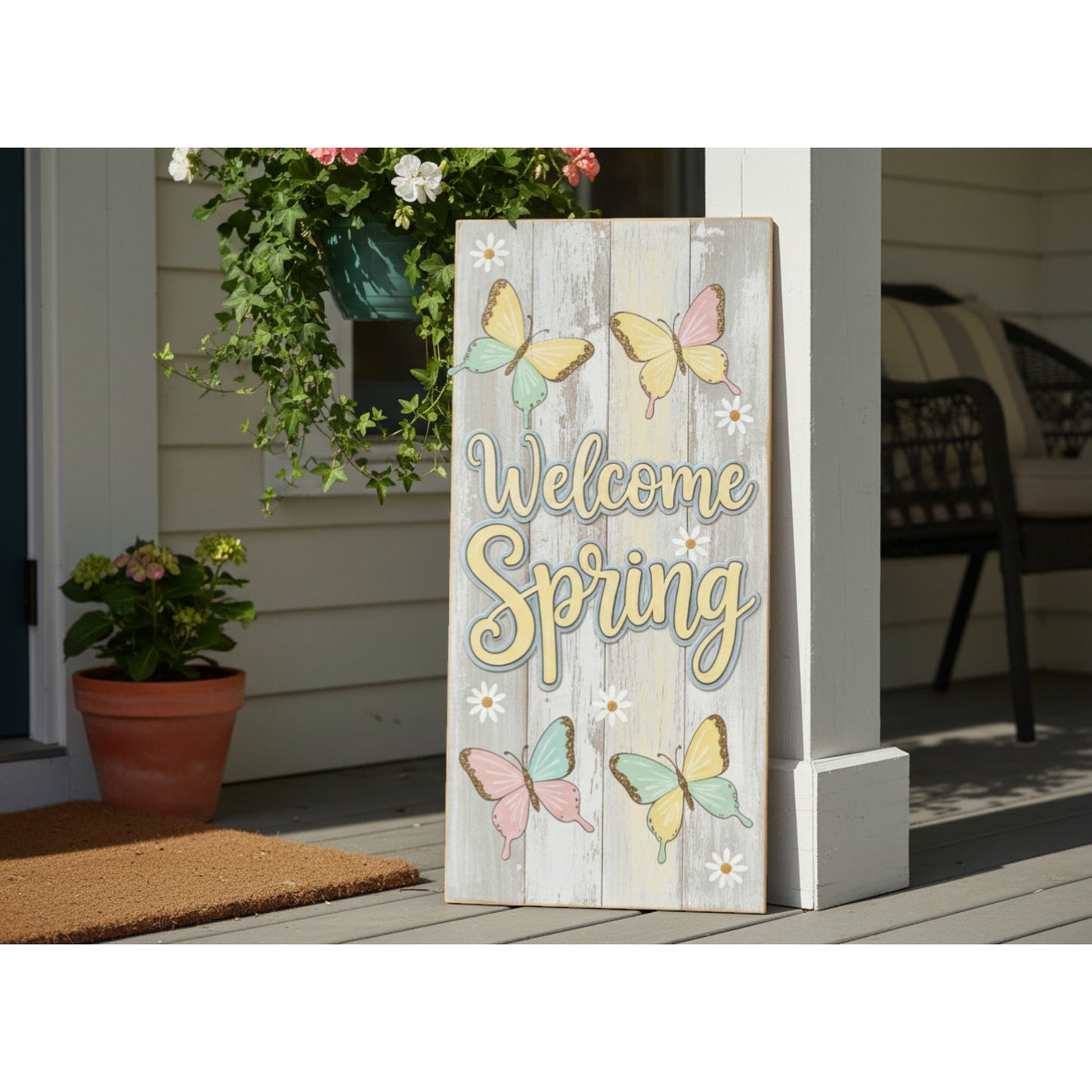 Decorative sign with 'Welcome Spring' text and butterflies on a porch.