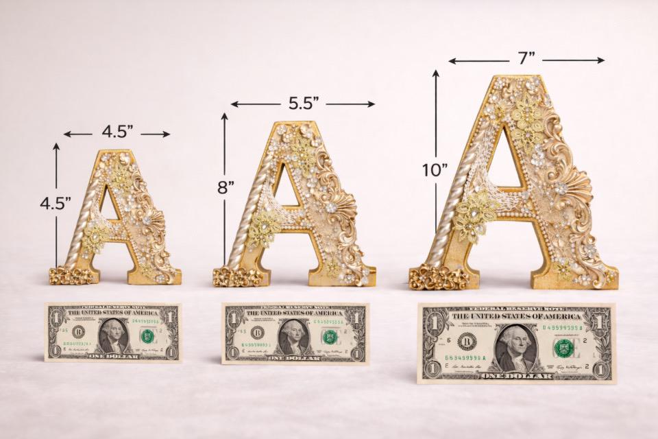 Decorative gold letters 'A' with measurements and dollar bill scale on a white background