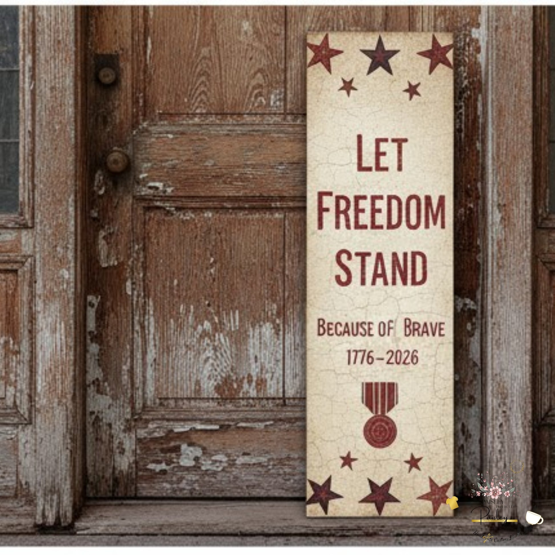 Decorative sign with 'Let Freedom Stand' text and stars on a wooden background